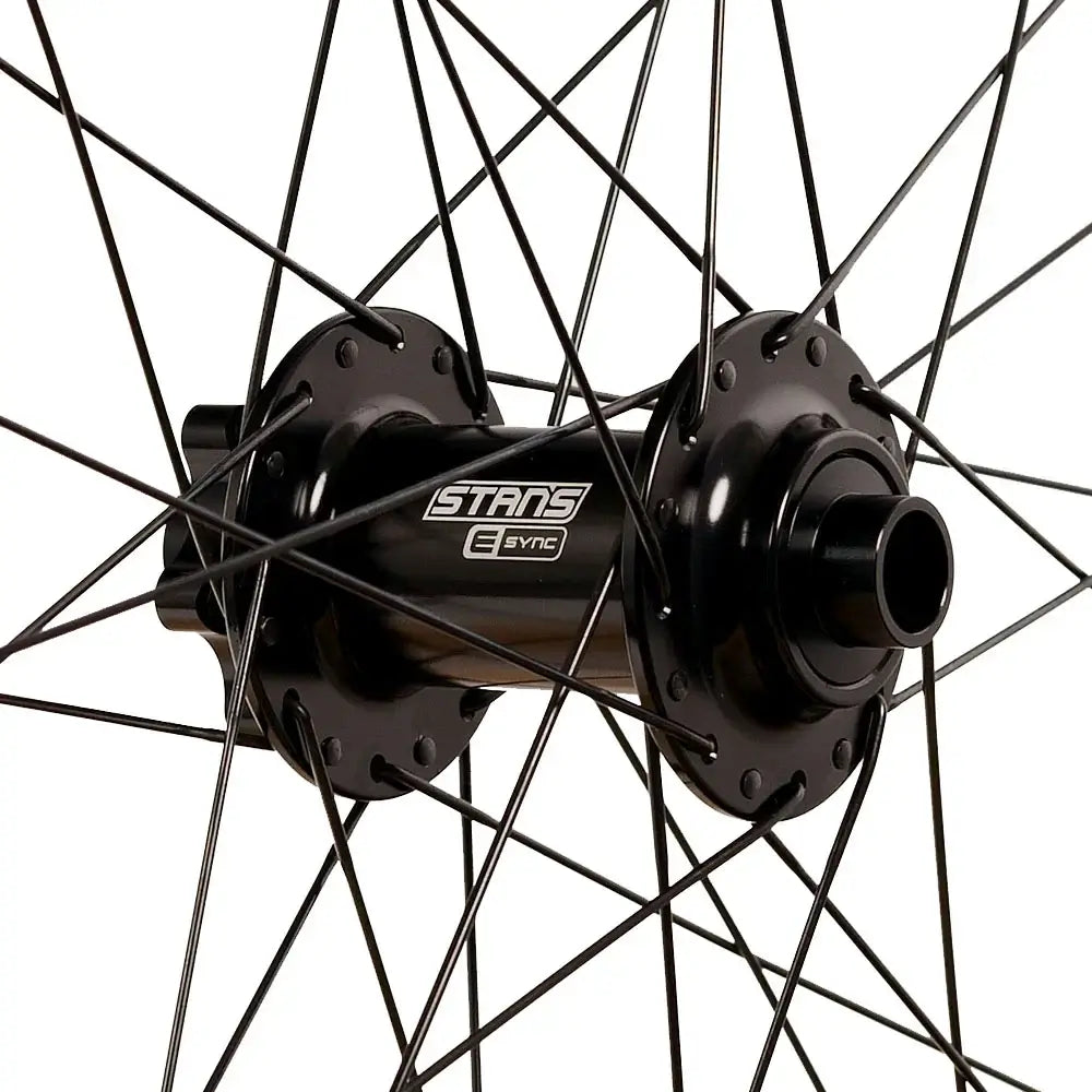 Stans E-Sync front hub with black finish, designed for high-performance mountain biking and durability.
